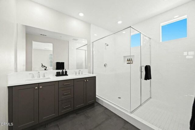 26945 Nature View Pl, Valencia, CA 91381 - bathroom featuring a stall shower, double vanity, tile patterned flooring, and recessed lighting