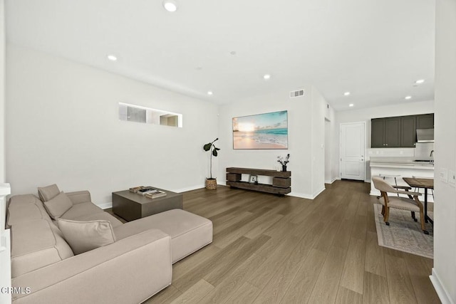 26945 Nature View Pl, Valencia, CA 91381 - living room featuring wood finished floors, recessed lighting, and baseboards