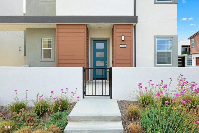 26945 Nature View Pl, Valencia, CA 91381 - property entrance with fence, stucco siding, and a gate