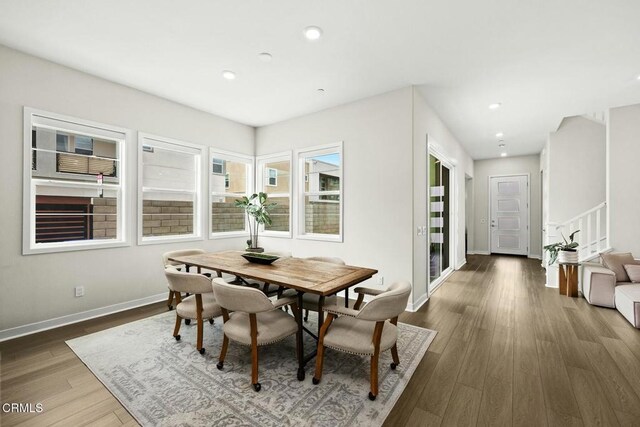 26945 Nature View Pl, Valencia, CA 91381 - dining room featuring baseboards, wood finished floors, recessed lighting, and stairway