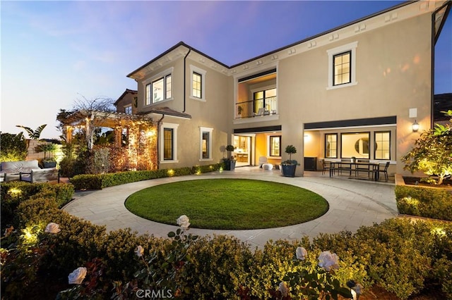 212 Clear Fls, Irvine, CA 92602 - back of house with a pergola, a patio area, a balcony, a lawn, and stucco siding