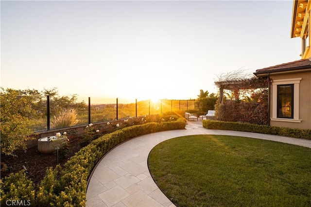 212 Clear Fls, Irvine, CA 92602 - yard at dusk featuring a patio area and fence