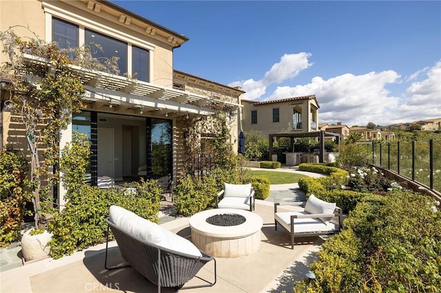 212 Clear Fls, Irvine, CA 92602 - view of patio with fence, a pergola, and an outdoor living space with a fire pit