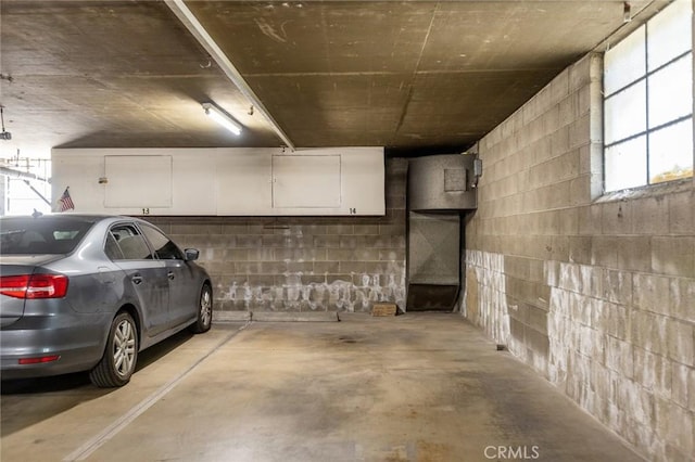 parking deck featuring concrete block wall