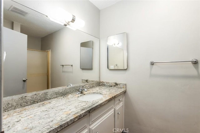 bathroom featuring vanity and visible vents