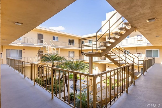 balcony featuring stairway