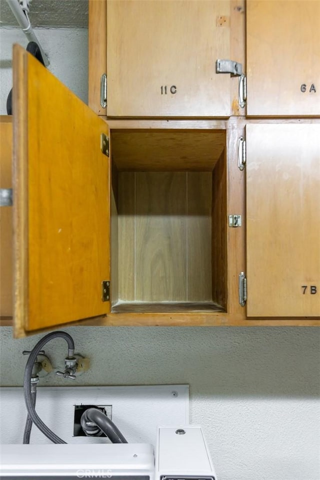 interior details featuring brown cabinetry and light countertops