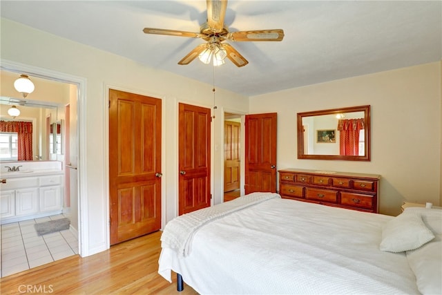 2307 Cameron Ave, Covina, CA 91724 - bedroom featuring a sink, light wood finished floors, two closets, a ceiling fan, and ensuite bathroom
