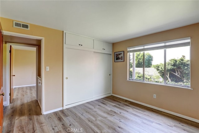 2307 Cameron Ave, Covina, CA 91724 - unfurnished bedroom featuring baseboards, a closet, light wood-style flooring, and visible vents