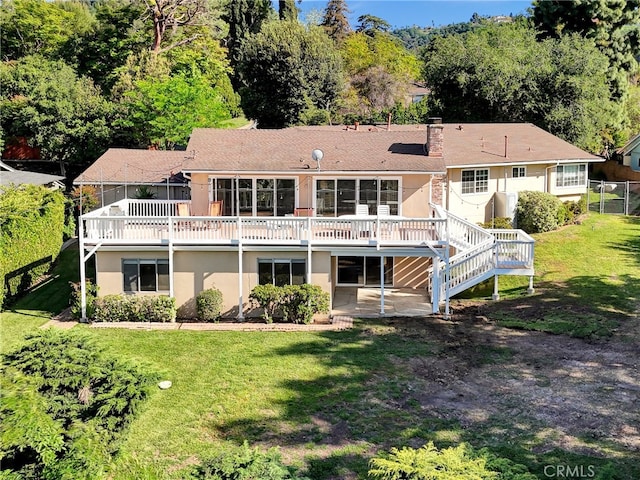 2307 Cameron Ave, Covina, CA 91724 - rear view of property with stucco siding, a yard, a chimney, and a deck