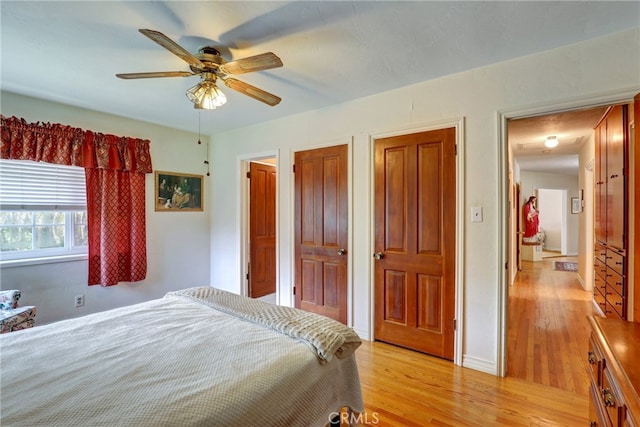 2307 Cameron Ave, Covina, CA 91724 - bedroom featuring light wood finished floors, ceiling fan, and two closets