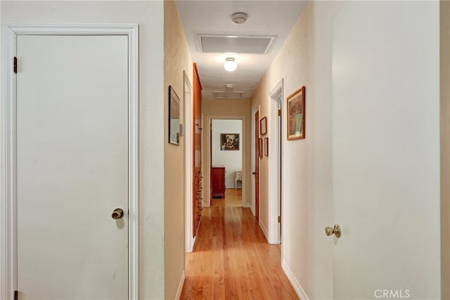 2307 Cameron Ave, Covina, CA 91724 - corridor with light wood-type flooring, attic access, baseboards, and visible vents