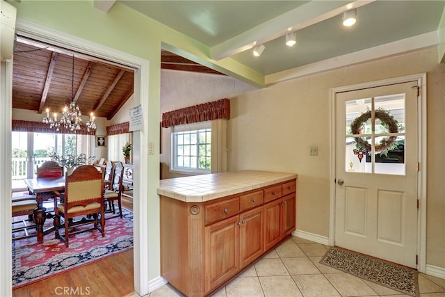 2307 Cameron Ave, Covina, CA 91724 - kitchen featuring an inviting chandelier, baseboards, tile countertops, wooden ceiling, and lofted ceiling with beams