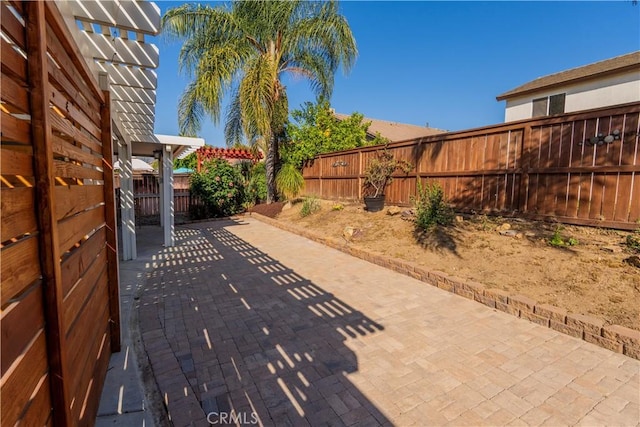 view of patio with a pergola and a fenced backyard