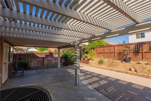 view of patio / terrace with a fenced backyard and a pergola