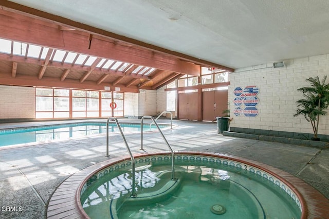 pool with an indoor hot tub
