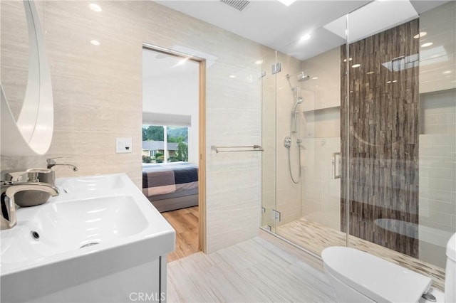 26011 Redbluff Dr, Calabasas, CA 91302 - ensuite bathroom featuring a stall shower, ensuite bathroom, toilet, and a sink