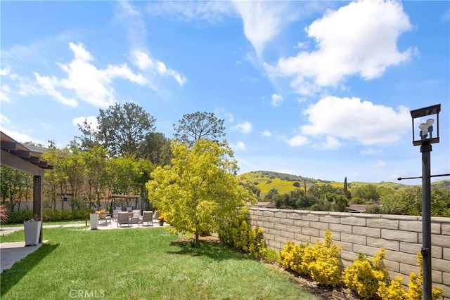 26011 Redbluff Dr, Calabasas, CA 91302 - view of yard featuring fence, a patio, an outdoor living space, and a mountain view