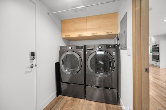 26011 Redbluff Dr, Calabasas, CA 91302 - washroom with light wood finished floors, washing machine and dryer, baseboards, and laundry area