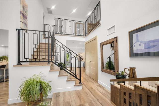 26011 Redbluff Dr, Calabasas, CA 91302 - stairway with visible vents, wood finished floors, baseboards, and a high ceiling