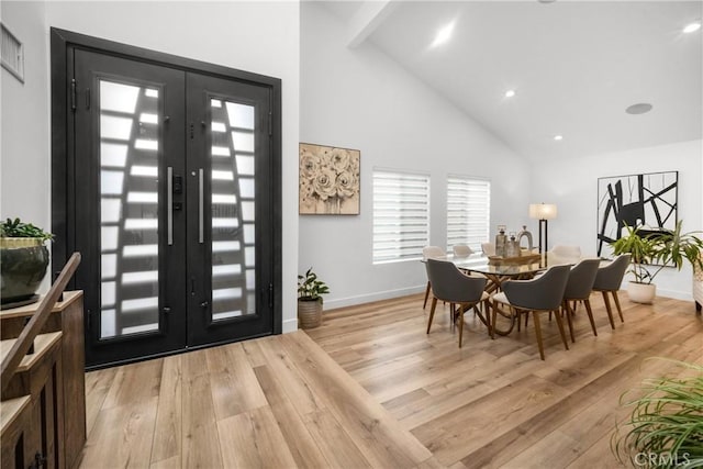 26011 Redbluff Dr, Calabasas, CA 91302 - entryway with light wood-style flooring, baseboards, high vaulted ceiling, and french doors