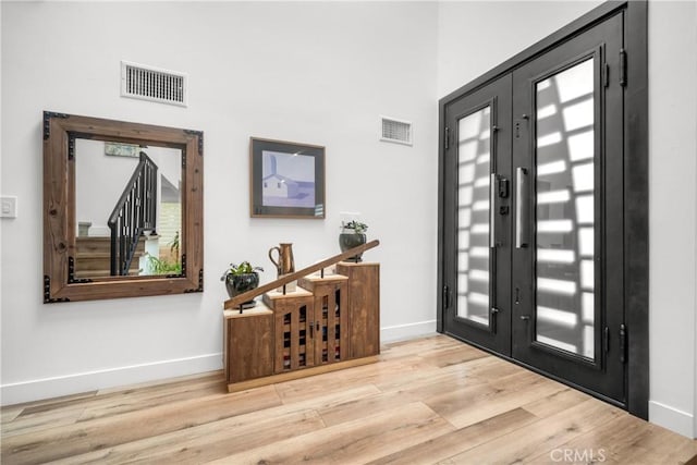 26011 Redbluff Dr, Calabasas, CA 91302 - entrance foyer featuring baseboards, visible vents, and wood finished floors