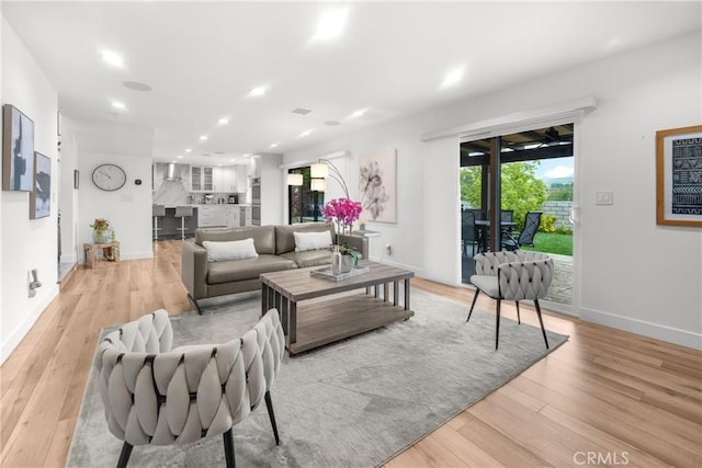 26011 Redbluff Dr, Calabasas, CA 91302 - living area featuring light wood-type flooring, plenty of natural light, and baseboards