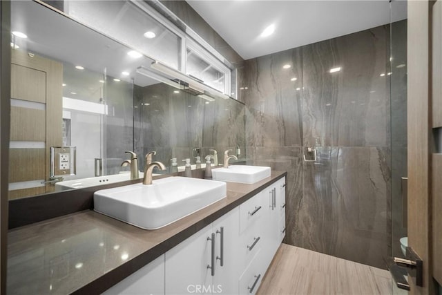 26011 Redbluff Dr, Calabasas, CA 91302 - full bathroom featuring a sink, double vanity, and tile walls