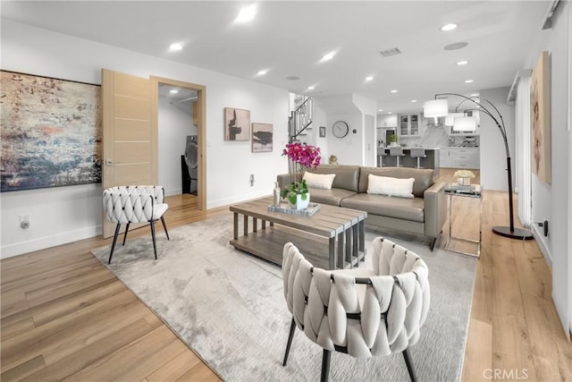 26011 Redbluff Dr, Calabasas, CA 91302 - living room with stairway, recessed lighting, and light wood-style floors