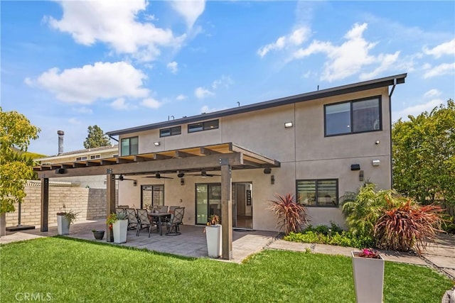 26011 Redbluff Dr, Calabasas, CA 91302 - rear view of house with a lawn, fence, ceiling fan, a patio area, and stucco siding