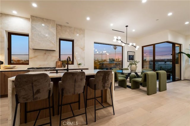 2219 W Starview Ln, Los Angeles, CA 90026 - bar area featuring a sink, recessed lighting, a chandelier, and decorative light fixtures