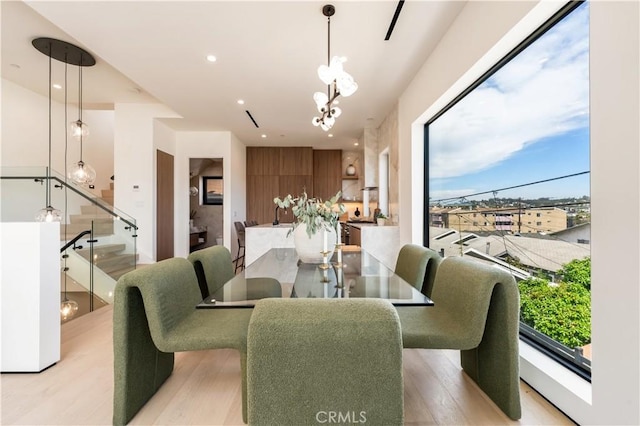 2219 W Starview Ln, Los Angeles, CA 90026 - dining room featuring stairs, light wood finished floors, plenty of natural light, a chandelier, and recessed lighting