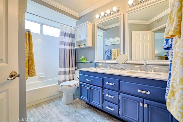 full bath featuring wood finished floors, a sink, double vanity, and toilet