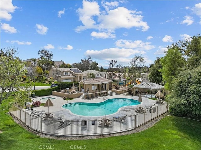 pool featuring a patio area and fence