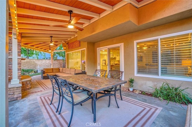 view of patio with fence, ceiling fan, and outdoor dining area