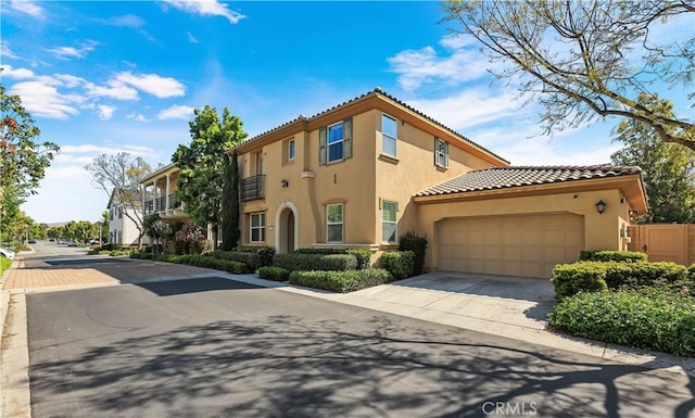 213 Wicker, Irvine, CA 92618 - mediterranean / spanish-style house with stucco siding, an attached garage, a tile roof, and concrete driveway