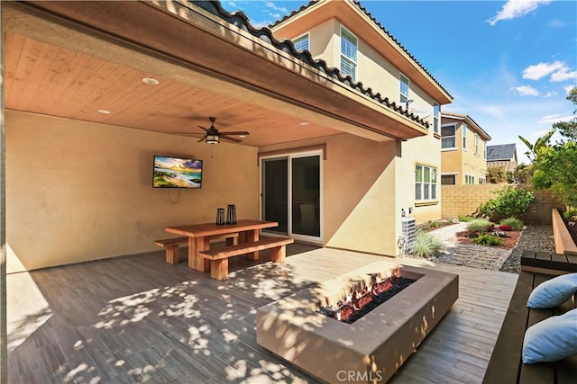 213 Wicker, Irvine, CA 92618 - wooden deck featuring an outdoor fire pit, a ceiling fan, and outdoor dining space