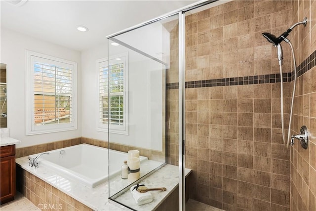 213 Wicker, Irvine, CA 92618 - bathroom featuring a shower stall, a bath, vanity, and recessed lighting