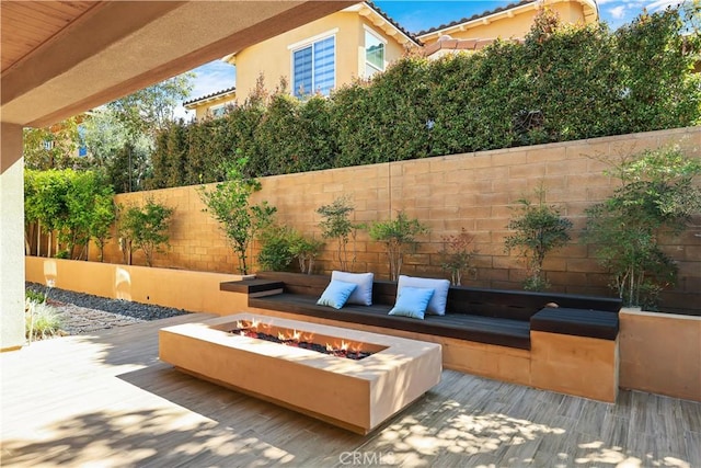 213 Wicker, Irvine, CA 92618 - view of patio / terrace with a fire pit and a wooden deck