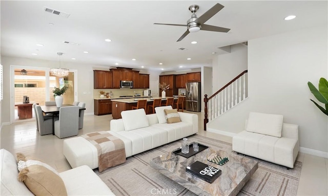 213 Wicker, Irvine, CA 92618 - living room with recessed lighting, a ceiling fan, baseboards, stairs, and a chandelier