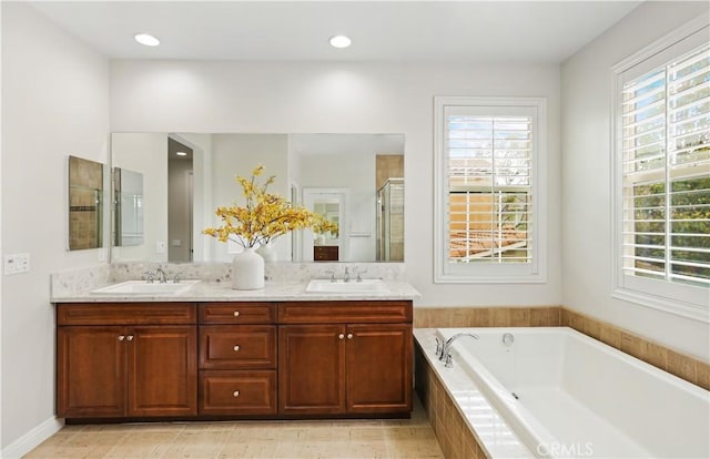 213 Wicker, Irvine, CA 92618 - bathroom featuring plenty of natural light, a stall shower, double vanity, and a bath