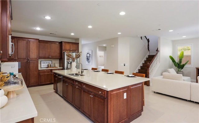 213 Wicker, Irvine, CA 92618 - kitchen with a sink, dishwashing machine, an island with sink, light countertops, and recessed lighting
