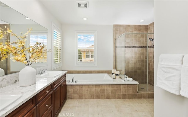 213 Wicker, Irvine, CA 92618 - bathroom featuring plenty of natural light, a shower stall, a garden tub, and recessed lighting