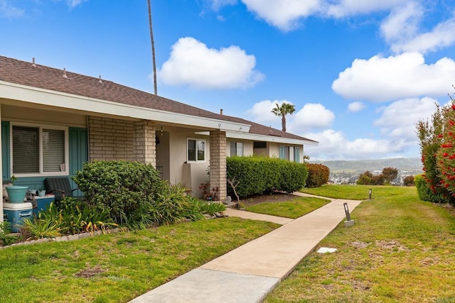3755 Vista Campana N Unit 58, Oceanside, CA 92057 - exterior space featuring stucco siding and a front lawn