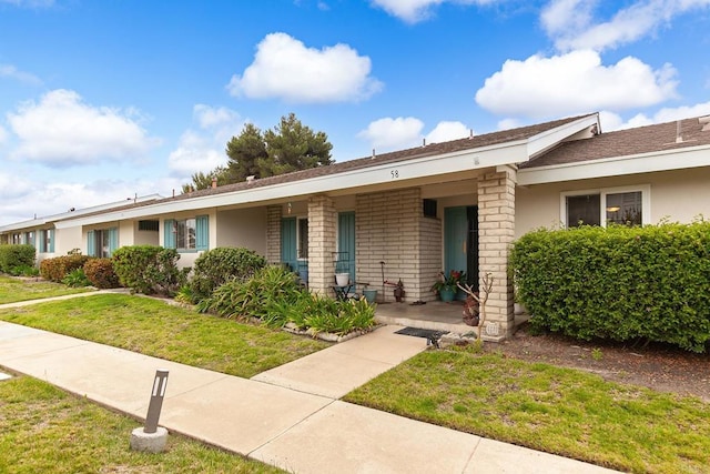 3755 Vista Campana N Unit 58, Oceanside, CA 92057 - ranch-style house featuring covered porch, stucco siding, and a front yard