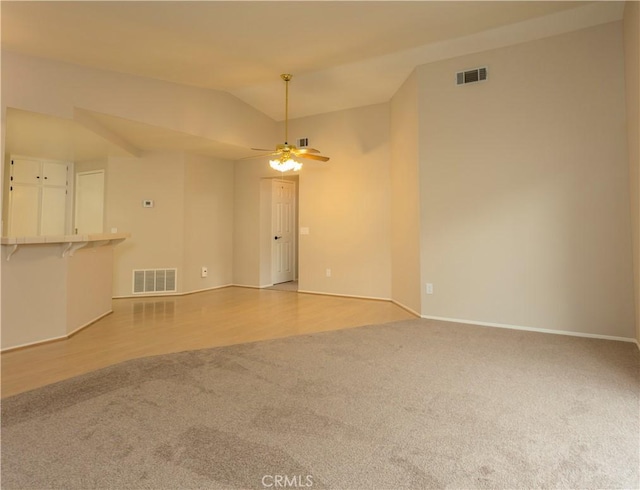 28050 Bavaria Dr, Menifee, CA 92585 - carpeted spare room with baseboards, ceiling fan, visible vents, and vaulted ceiling