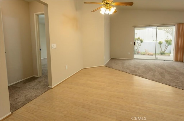 28050 Bavaria Dr, Menifee, CA 92585 - spare room with baseboards, lofted ceiling, ceiling fan, and carpet floors
