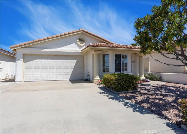 28050 Bavaria Dr, Menifee, CA 92585 - mediterranean / spanish-style home with a tile roof, concrete driveway, a garage, and stucco siding