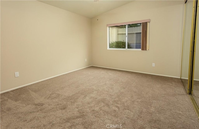 28050 Bavaria Dr, Menifee, CA 92585 - unfurnished bedroom with lofted ceiling, baseboards, a closet, and carpet floors
