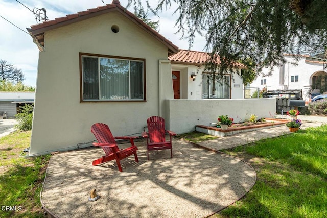 3059 Glenrose Ave, Altadena, CA 91001 - view of front of home with a patio area, a tiled roof, stucco siding, and fence